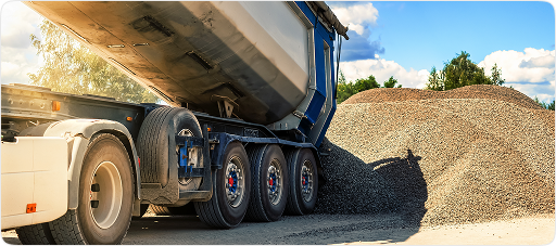 Resellers card, dump truck unloading construction materials